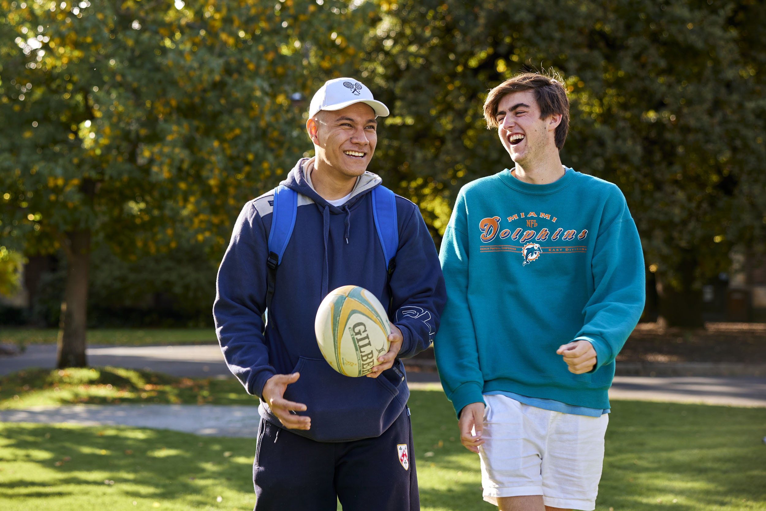 Sporty students walking in the sunshine